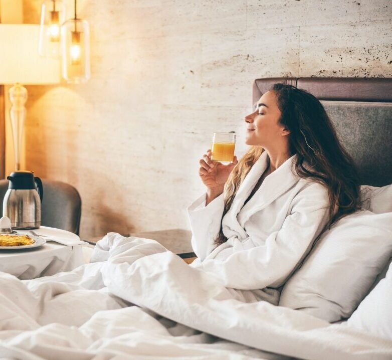 woman-eating-breakfast-in-the-hotel-room-room-service-breakfast-in-hotel-room-1-1.jpg